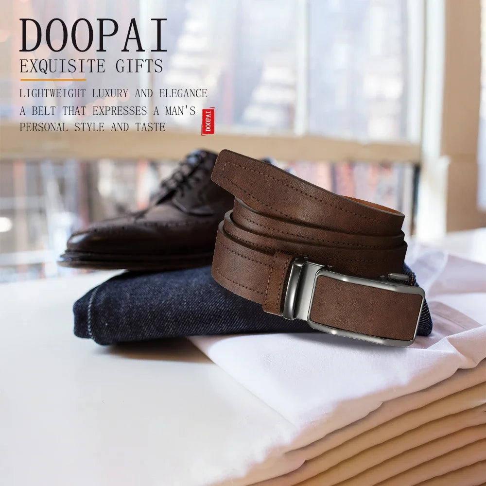 A brown leather belt with a silver automatic buckle resting on a white cloth next to a dark boot.