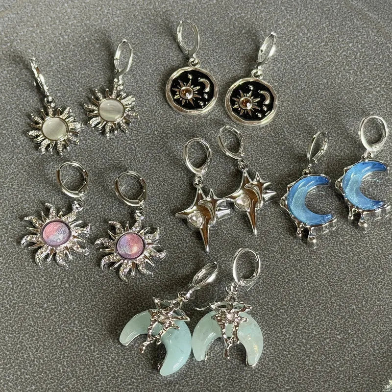 A collection of Y2K sun moon stainless steel hoop earrings featuring various designs and finishes.