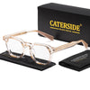 A pair of clear, retro square anti-blue light eyeglasses resting on a black cloth next to a black box labeled CATERSIDE BRAND