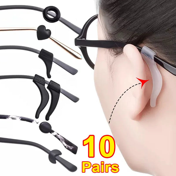 A set of ten pairs of black anti-slip silicone ear hooks for eyeglasses, shown next to a person's ear.