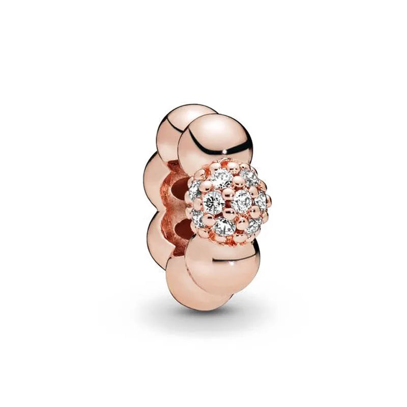 Rose gold cherry blossom charm pendant featuring a cluster of small diamonds.