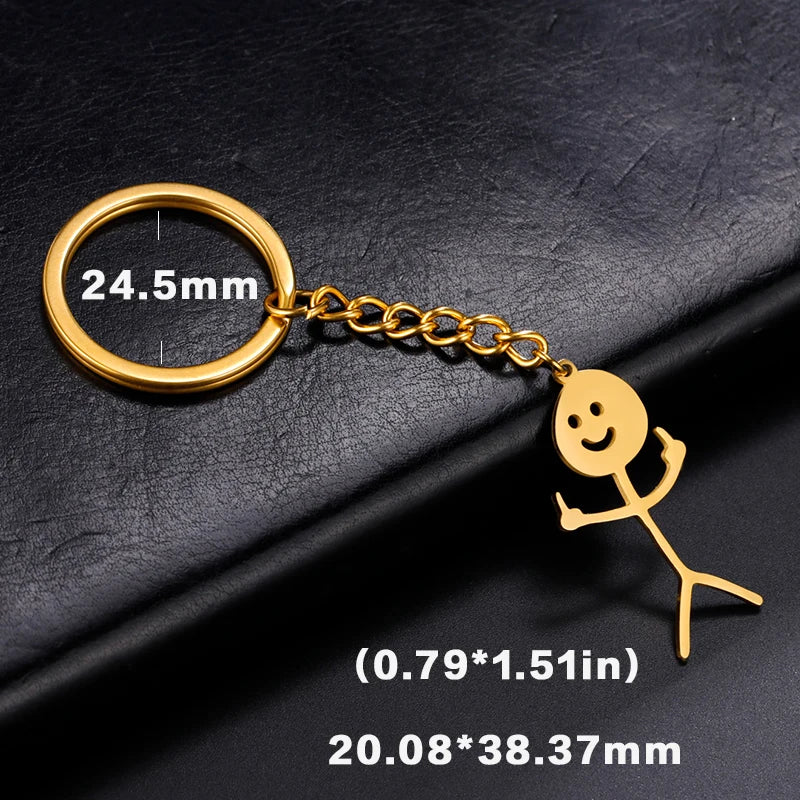 Gold-colored stickman middle finger keychain with a 24.5mm ring and dimensions 20.08x38.37mm