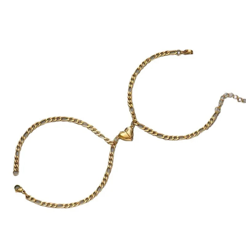 A gold-toned stainless steel heart magnetic bracelet set for couples.