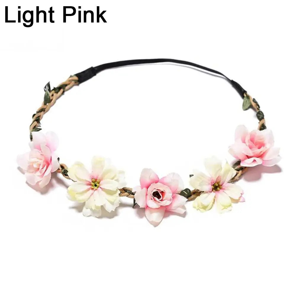 A light pink bohemian flower headband made of dried flowers and vines for women