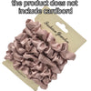 A pile of mauve satin hair scrunchies is shown on a cardboard backing.