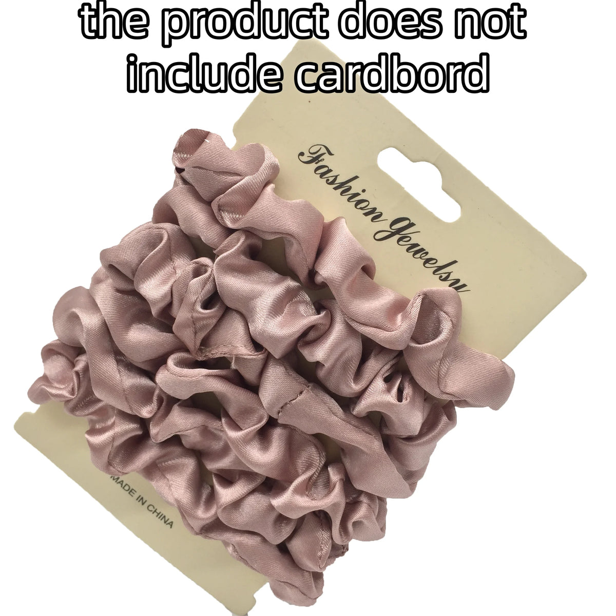 A pile of mauve satin hair scrunchies is shown on a cardboard backing.