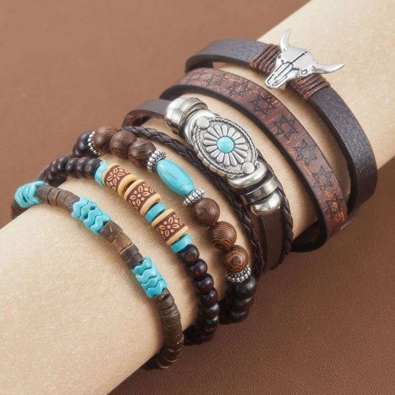 A set of handcrafted retro western beaded bracelets on a wrist, featuring leather and wooden beads and silver accents.