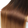 Close-up of long, straight brown hair extensions with a subtle ombre effect