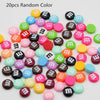 A collection of 20 random color resin nail art charms scattered on a white background.