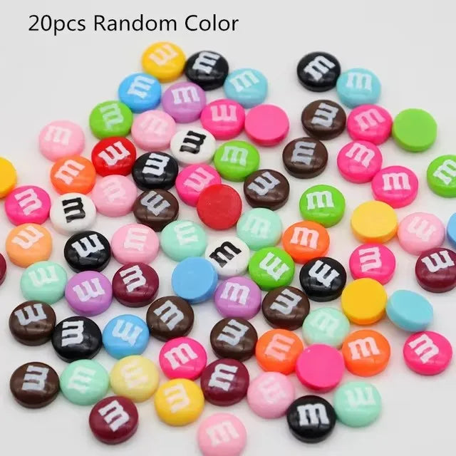 A collection of 20 random color resin nail art charms scattered on a white background.