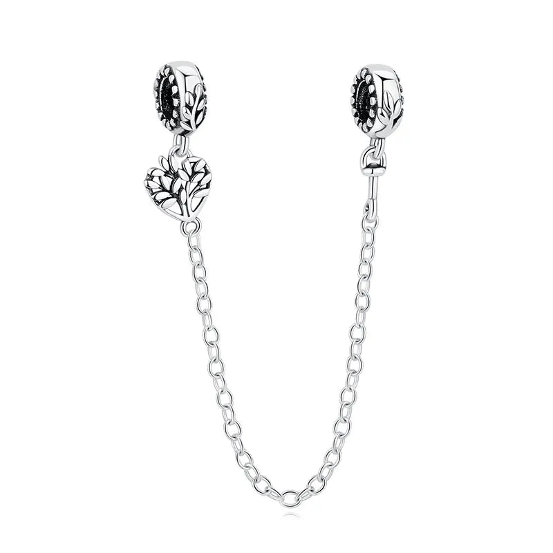 A silver family tree charm necklace featuring a detailed leaf design and a delicate chain.