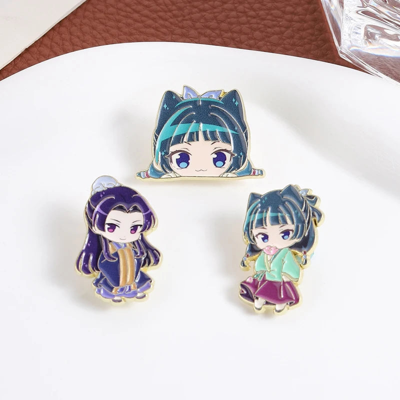 A cute anime character brooch featuring a girl with blue hair and cat ears, wearing a purple outfit.
