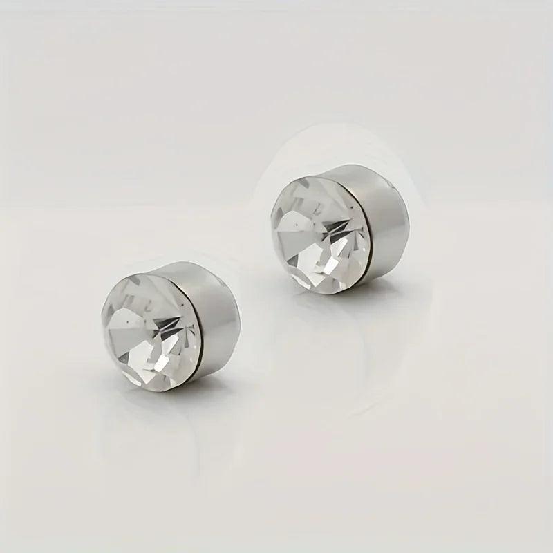 Silver magnetic nose stud earrings with cubic zirconia stones shown against a white background.