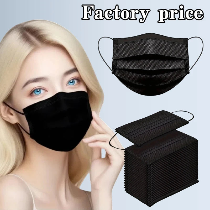 A black disposable protective face mask is shown on a model and packaged in a box.