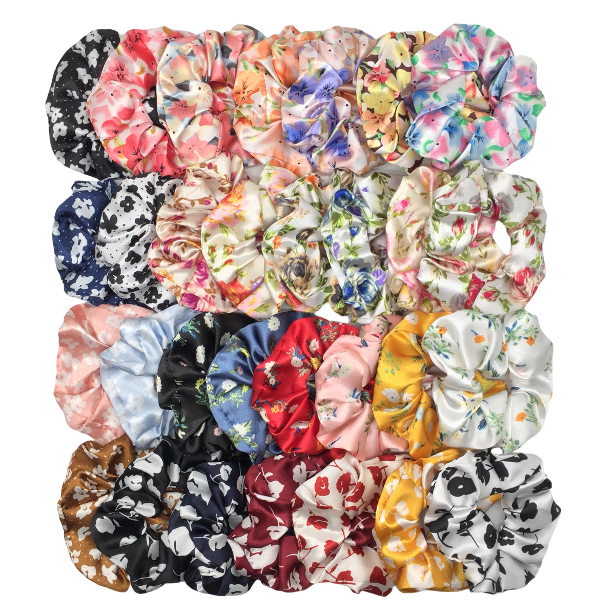 Una colección de seis gomas para el pelo con estampado floral de satén en varios colores y patrones.