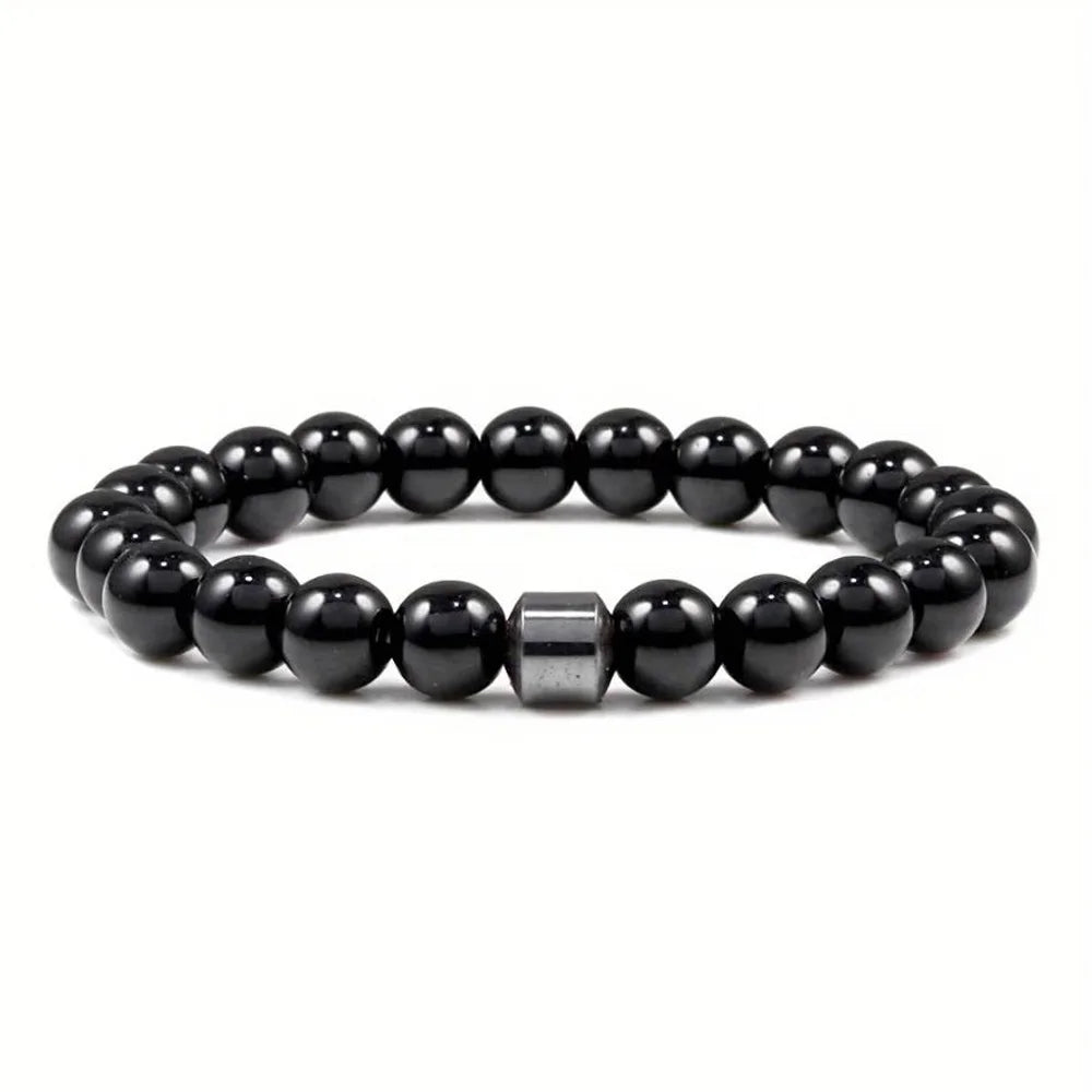 A black Tiger Eye lava map bracelet made of polished, round beads.