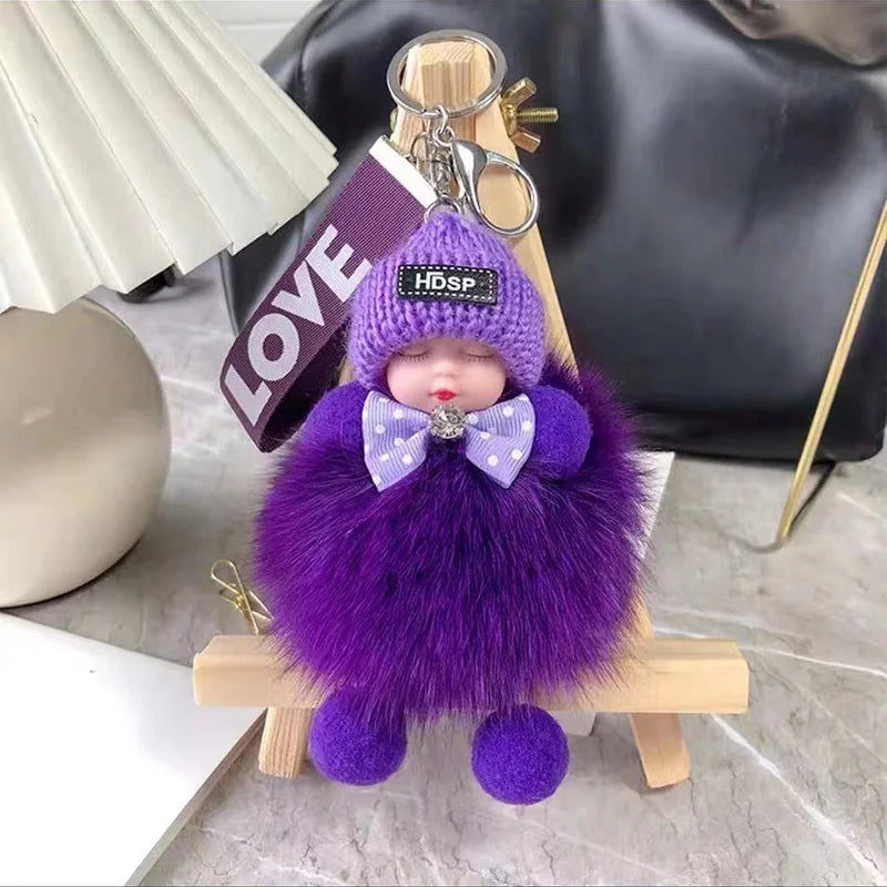 A purple fluffy plush doll with a bow and an HDSP tag is displayed on a wooden stick.