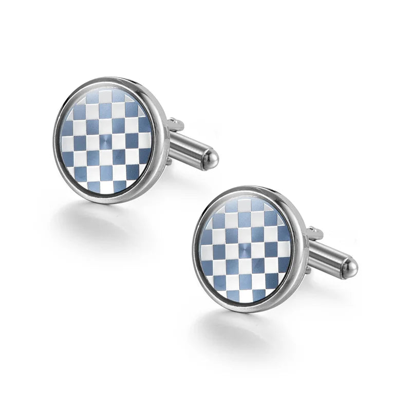 Silver cufflinks with a blue and white checkered pattern set against a white background.