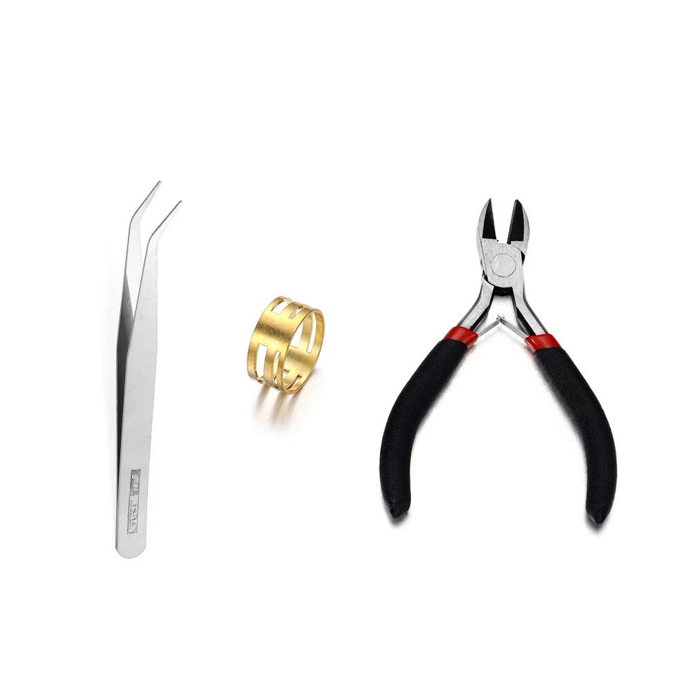 A set of jewelry findings including a silver pin, gold jump rings, and pliers.
