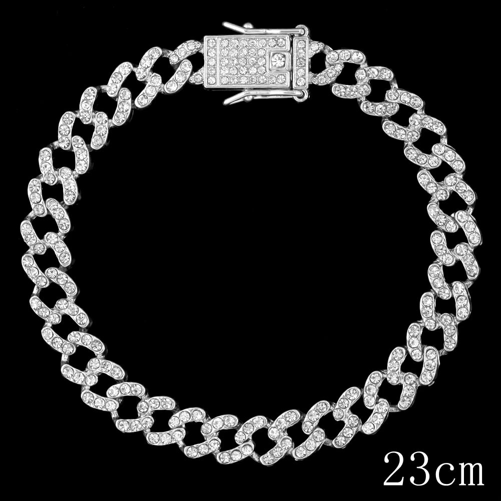 A diamond-encrusted crystal Cuban link anklet with a rectangular clasp shown against a black background.