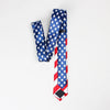 A navy blue and red striped silk necktie featuring a patriotic American flag design.