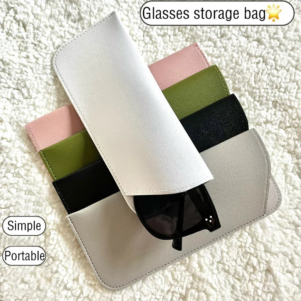 A stack of stylish PU leather glasses storage bags in various colors including white, pink, green, and black.