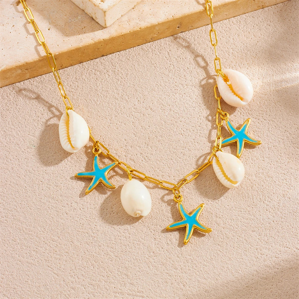 Gold-toned stainless steel necklace featuring starfish and seashell pendants.