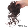 A hand is holding a bundle of dark brown messy synthetic hair, likely for a bun or styling.
