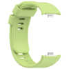 A light green replacement silicone watch strap for a smartwatch, shown from the side.