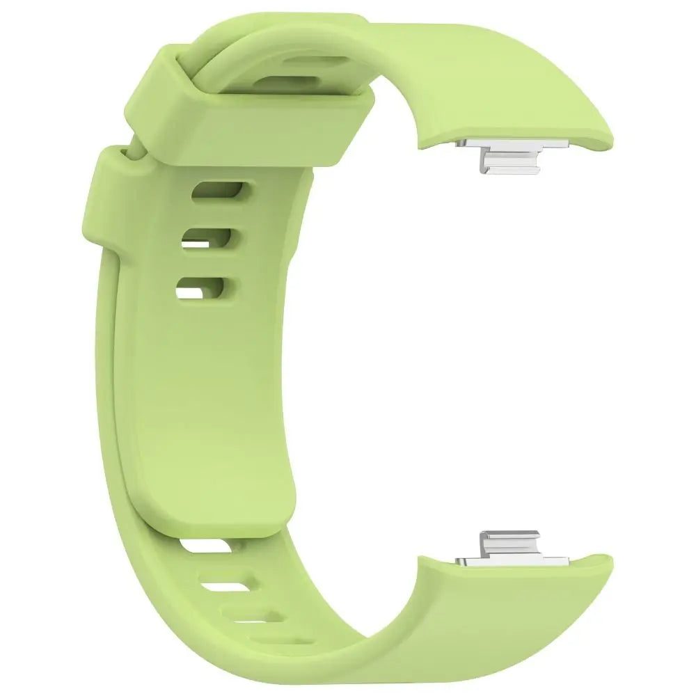 A light green replacement silicone watch strap for a smartwatch, shown from the side.