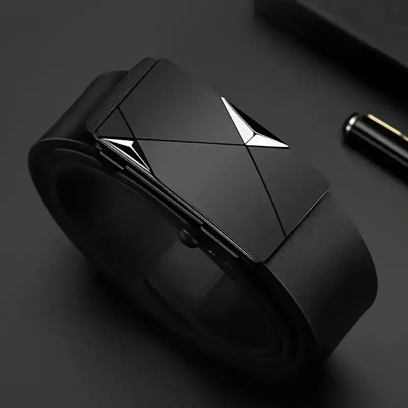 A close-up shot of a black men's PU leather fashion belt with a geometric silver buckle.