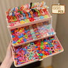 A box of colorful butterfly hair accessories featuring various pink, yellow, and blue floral shapes.