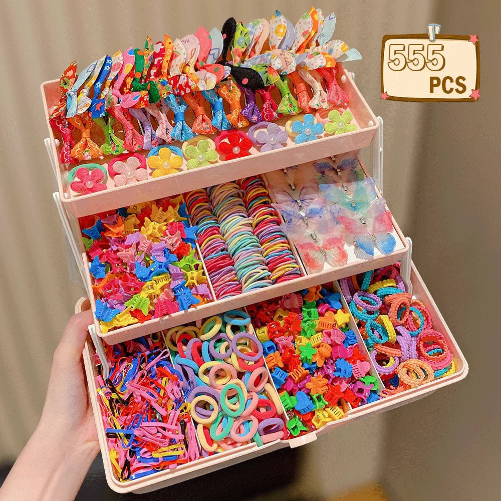 A box of colorful butterfly hair accessories featuring various pink, yellow, and blue floral shapes.