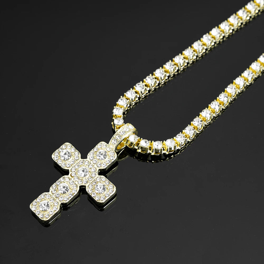 A gold-toned necklace featuring a sparkling rhinestone cross pendant on a delicate chain.