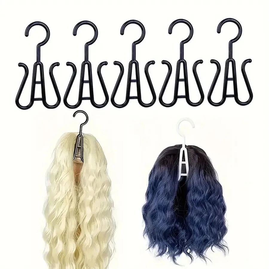A set of black multi-use wig and accessory hangers with various curved hooks shown next to a blonde and a dark blue wig.