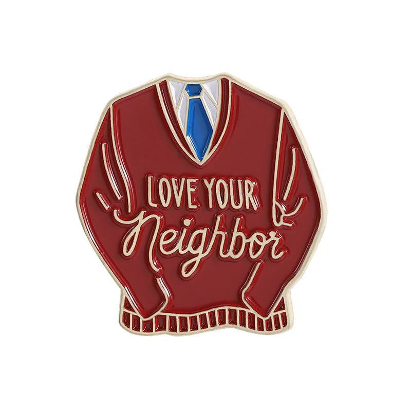 Broche émaillée rouge représentant des bras stylisés et le texte Love Your Neighbor.