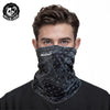 A man wearing a black patterned mask scarf for protection or fashion.