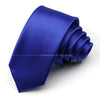 A deep blue satin neck tie folded and displayed on a white background.