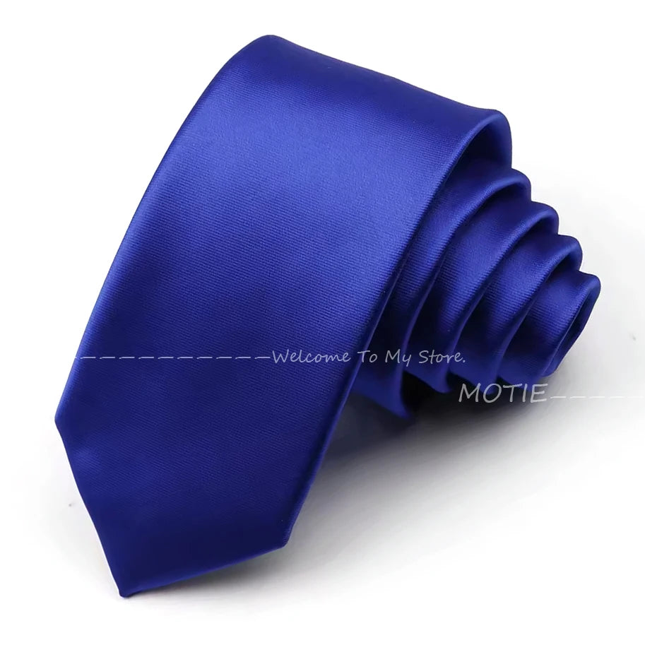 A deep blue satin neck tie folded and displayed on a white background.