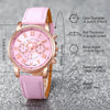 A pink fashion quartz wristwatch with a rose gold tone and a light pink leather strap shown with detailed dimensions.