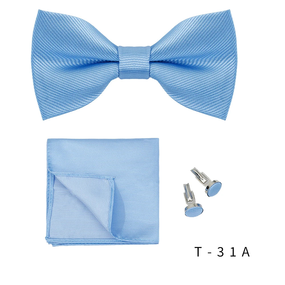 Light blue men's bow tie and cufflinks set displayed separately.