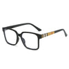 Black rectangular eyeglasses with tortoiseshell patterned temples and thin frames.