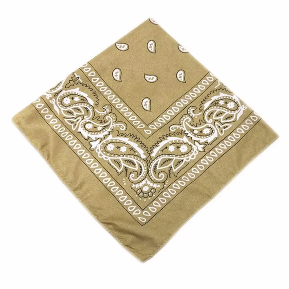 A square beige bandana featuring an intricate white bohemian print design.