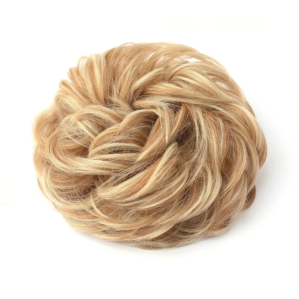 A light blonde hair piece styled into a large, messy bun for curly updos.