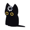 Black enamel pin of a cat face with white and gold details.