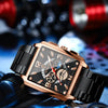 Nahaufnahme einer Rose-Gold-Luxus-Quarz-Armbanduhr mit dunklem Zifferblatt und leuchtenden Merkmalen, auf blauem Stoff.