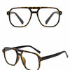 Gafas C2 Leopard con montura negra y lentes de tortuga shown in a product photo.