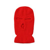 Helle rote Strickbalaclava und winddichte Skimaske.