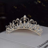 A sparkling crystal princess tiara hair comb for women displayed on a white surface.