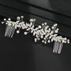 Elegant silver leafed crystal hair comb featuring delicate leaves and pearl accents.